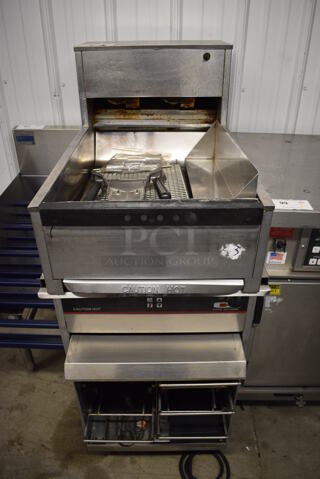 Carter Hoffmann Stainless Steel Crisp N Hold Dumping Station w/ Lower Warming Unit and Fry Scoop on Commercial Casters. Warming Drawer: 120 Volts, 1 Phase. Dumping Station: 208 Volts, 1 Phase. 19.5x34x48.5. Warming Unit Is Tested and Working!