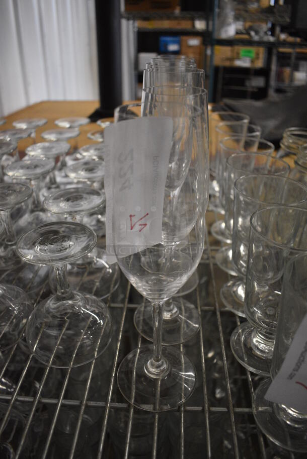 7 Various Champagne Flute Glasses. 2.5x2.5x9. 7 Times Your Bid!