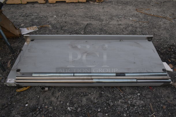 BRAND NEW SCRATCH AND DENT! Regency 600TSB3072S Stainless Steel Commercial Tabletop w/ Back Splash and Under Shelf. - Image 1 of 4
