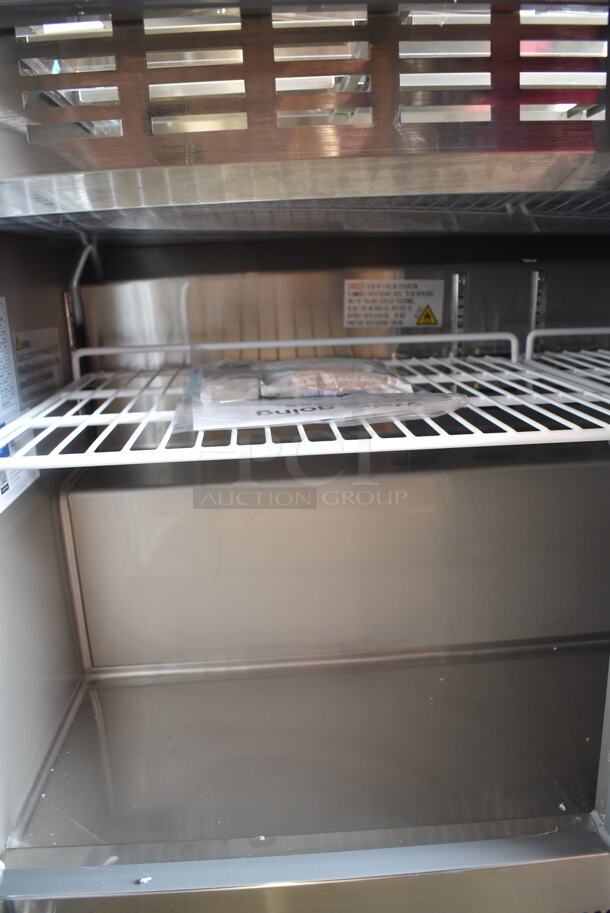 BRAND NEW SCRATCH AND DENT! 2024 Avantco 178SSCFT72HC Stainless Steel Commercial Refrigerated Salad Bar / Cold Food Table on Commercial Casters. 115 Volts, 1 Phase. Tested and Working! - Image 11 of 12