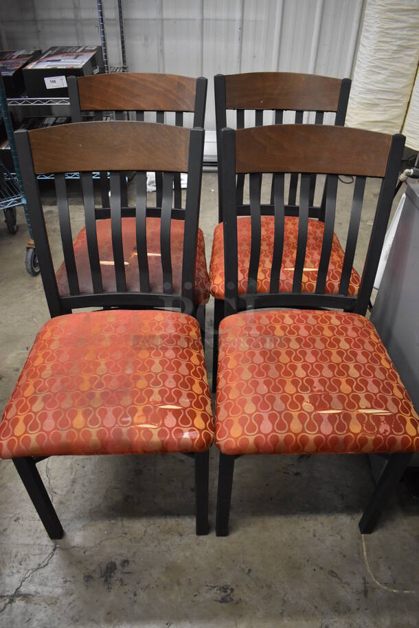 4 Black Metal Dining Chairs w/ Wood Pattern Top Back Rest Piece and Red Patterned Seats. 17x20x36. 4 Times Your Bid! 