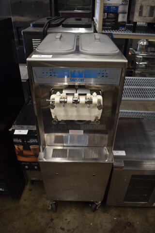 2010 Taylor 794-33 Commercial Stainless Steel Water Cooled 2 Hopper Soft Serve Ice Cream Machine On Commercial Casters. 208-230V, 3 Phase. 