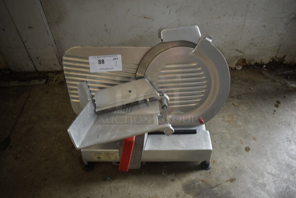 Fleetwood 12 Commercial Stainless Steel Electric Countertop Meat/Cheese Slicer On Rubber Stoppers. 115V, 1 Phase. Tested and Working!