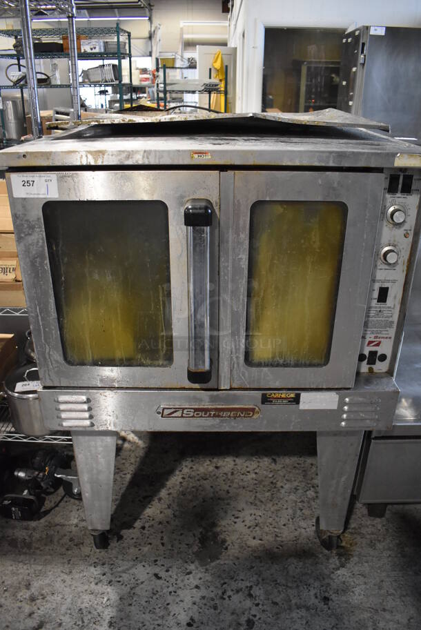 Southbend Stainless Steel Commercial Propane Gas Powered Full Size Convection Oven w/ View Through Doors, Metal Oven Racks and Thermostatic Controls on Commercial Casters. 38x38x55