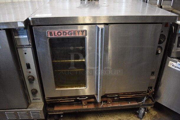 Blodgett Stainless Steel Commercial Natural Gas Powered Full Size Convection Oven w/ View Through Door, Solid Door, Metal Oven Racks and Thermostatic Controls on Commercial Casters. 38x40x38