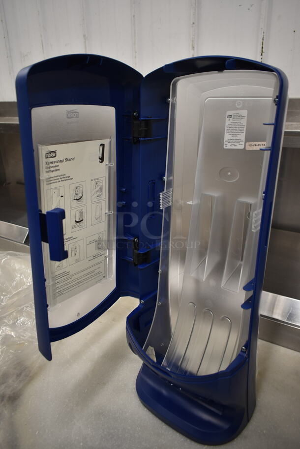 BRAND NEW IN BOX! Tork Blue and Clear Poly Napkin Dispenser. - Image 4 of 5