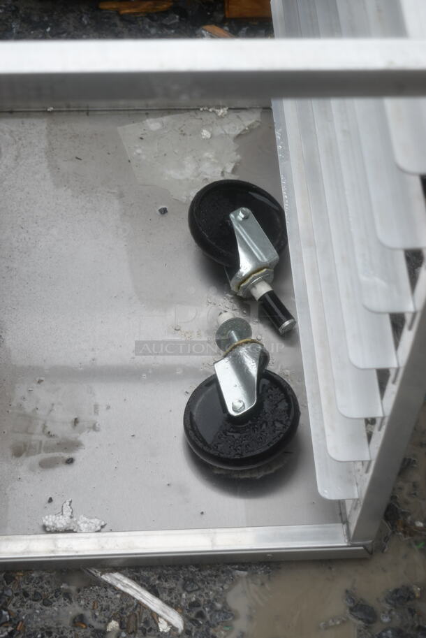 BRAND NEW SCRATCH AND DENT! Regency 600UPR8WTELS 8 Pan End Load Aluminum Undercounter Bun / Sheet Pan Rack with Stainless Steel Top. 2 Casters Need To Be Attached.  - Image 4 of 7