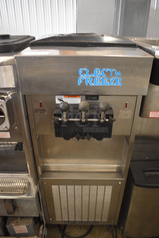 Electro Freeze Model SL500-232 Stainless Steel Commercial Floor Style Air Cooled 2 Flavor w/ Twist Soft Serve Ice Cream Machine on Commercial Casters. 208-230 Volts, 3 Phase. 22x34x60