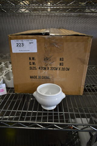 Box of White Ceramic Footed Bowls. 