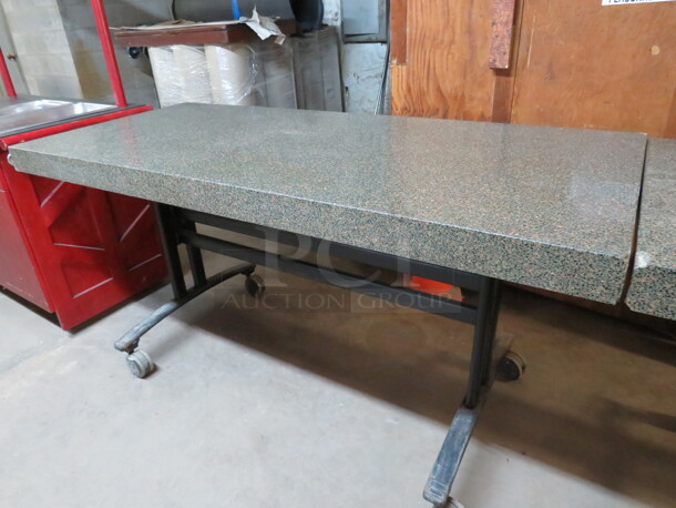 One Work Table With A Granite Look Top On A Metal Base On Casters. 72X32X36