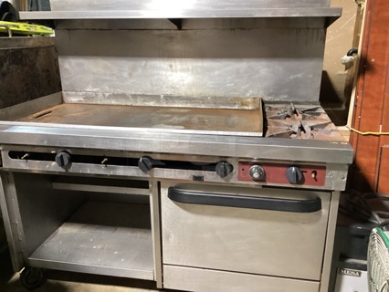 Stainless Steel 2-Burner Stove W/Flat Griddle, Single Oven, Under and Over Head Storage Shelves, on Castors. Not Tested, Natural Gas