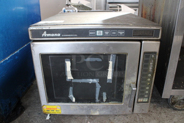 Amana Stainless Steel Commercial Countertop Microwave Oven. 19x25x18 - Image 1 of 5