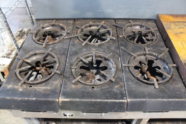 Garland Stainless Steel Commercial Propane Gas Powered 6 Burner Range w/ Flat Top Griddle, 2 Ovens, Over Shelf and Back Splash. Oven Doors and Door Handles Are Not Attached. Unit Appears To Have Been In The Process of Being Refurbished. 60x32x58 - Image 3 of 6