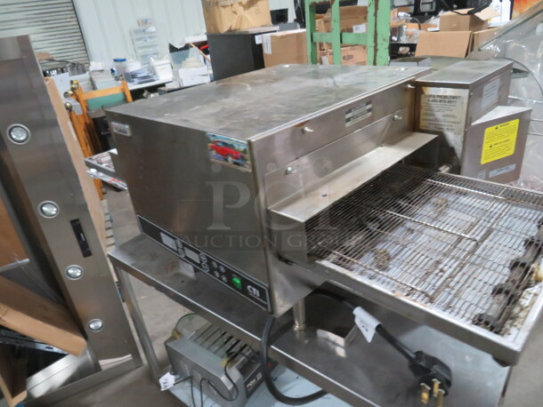 One CTI Lincoln Impinger Conveyor Pizza Oven On A Stainless Steel Table With SS Under Shelf On Casters. Model# 2502HB3U0701620. 240 Volt 1 Phase. Oven 50X32X18. Table 42X26X29. - Image 3 of 7