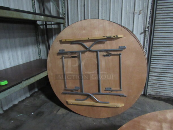 One 60 Inch Round Wooden Folding/Banquet Table With Metal Legs, And A Clear Coat Finish. $523.00. 60X30  - Image 2 of 2