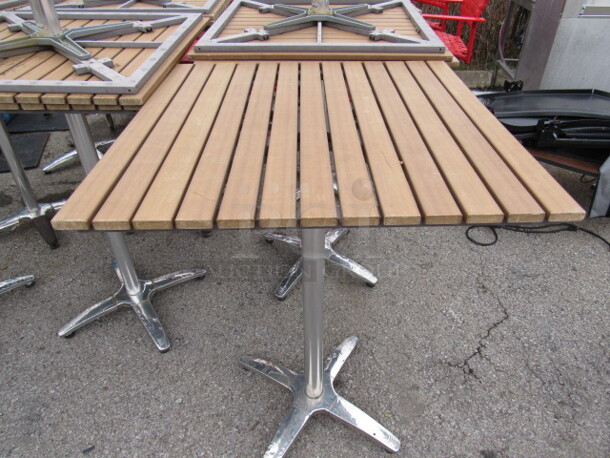 One 30X30X42.5 Bar Height Patio Table On A Chrome Pedestal Base. 