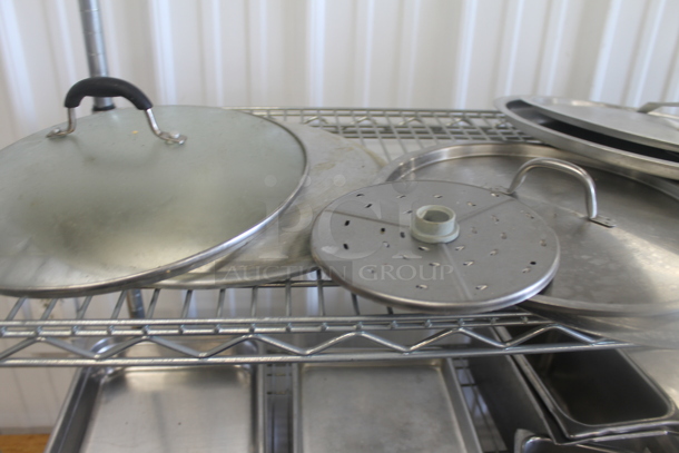 Chrome Finish 4 Tier Wire Shelving Unit on Commercial Casters w/ Contents Including Stainless Steel Drop In Bins and Bowls. BUYER MUST DISMANTLE. PCI CANNOT DISMANTLE FOR SHIPPING. PLEASE CONSIDER FREIGHT CHARGES. - Image 2 of 6