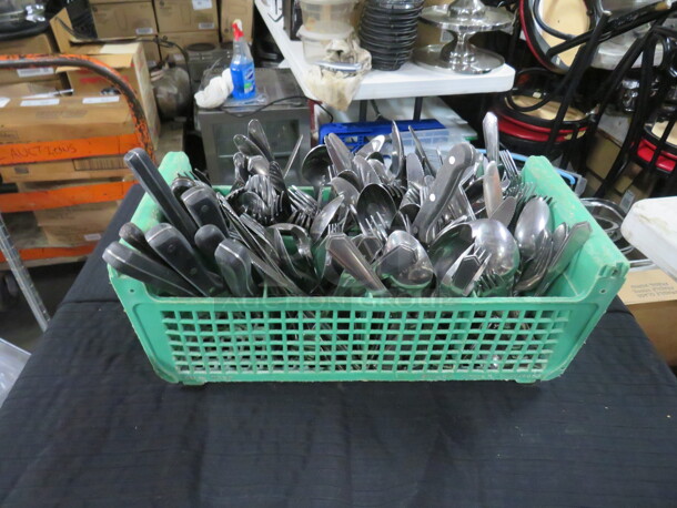 One Dishwasher Flatware Rack Full Of Assorted Flatware.