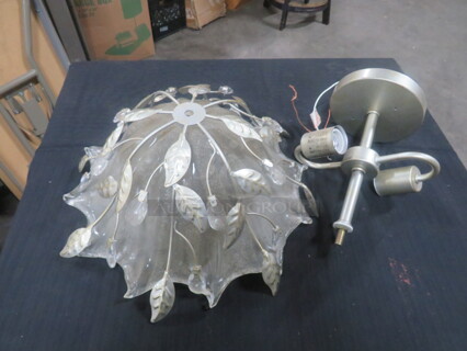 One Ceiling Mount 2 Bulb Light Fixture With Glass Globe.