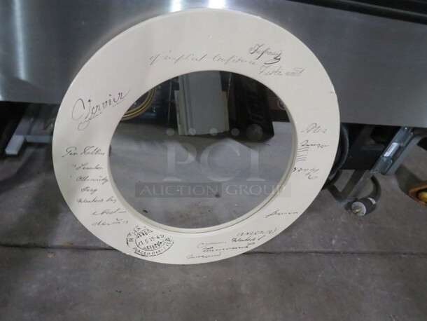 One 24 Inch Round Framed Mirror.