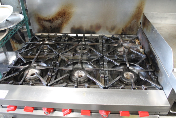 Vulcan Stainless Steel Commercial Natural Gas Powered 6 Burner Range w/ Flat Top, 2 Ovens, Over Shelf and Back Splash.  - Image 2 of 11