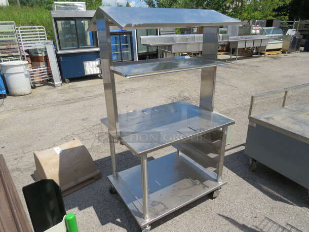 One Stainless Steel Table With SS Over Shelf, And SS Under Shelf, On Casters. 34X26X61.5