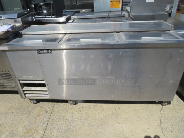 One Leader Bottle Box. Working NOT Cold 115 Volt. Model# ESBC72SC.  Box On Casters. 72X27X35  - Image 1 of 2