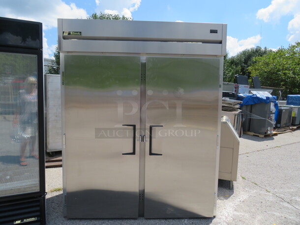 One Stainless Steel 2 Door TRUE Roll In Freezer. Model#  TG2F. 115-208-230 Volt. 1 Phase. 67.5X35X84