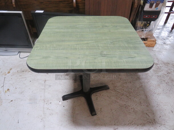 One Green Laminate Table Top On A Pedestal Base. 30X30X29