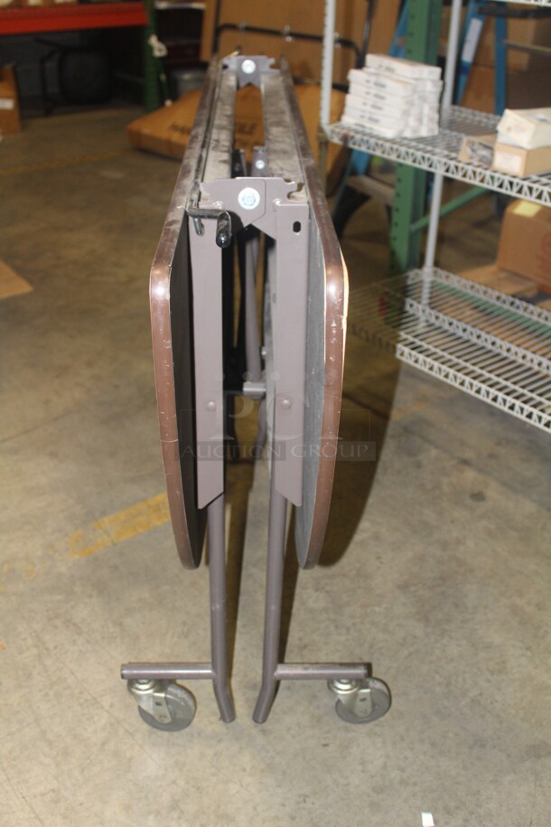 NICE! Round Folding Table On Casters. 60x39 - Image 3 of 3