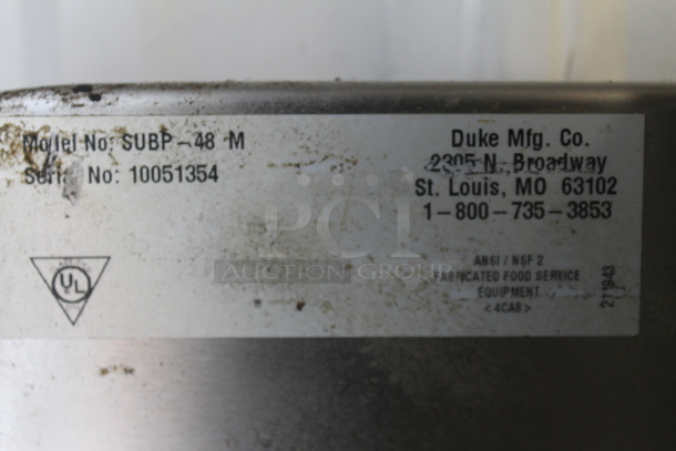 Duke SUBP-48 M Stainless Steel Commercial Counter w/ 2 Wood Pattern Doors and Back Splash.  - Image 4 of 4