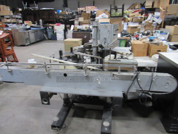 One Dynamatic Eaton Bottle Labeler. 130 Volt. 500 Avery. 86X39X56