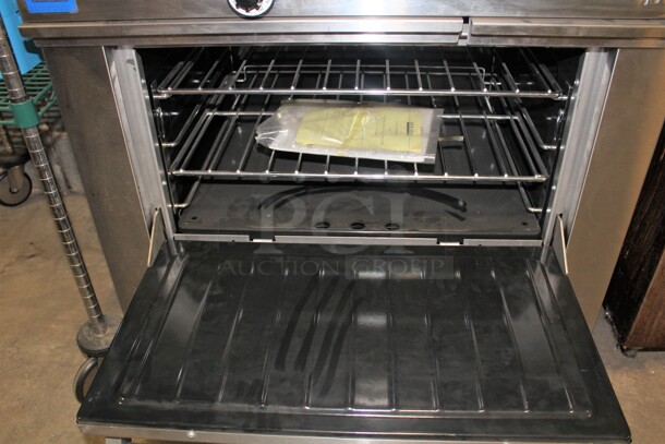 TERRIFIC! Garland 2 Burner Natural Gas Range With Full Size Oven, Griddle, Backsplash And Salamander Shelf On Casters! 36x34x59. Working When Pulled!  - Image 4 of 8