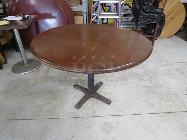 One 2 Inch Thick Solid Wooden Round Table Top On A Pedestal Base. 42X42X30
