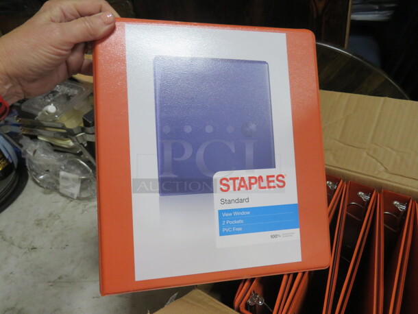 One Lot Of 12 NEW 1 Inch Orange Binders, And 2 Boxes Of 12 Sonix Gel Pens.  - Image 1 of 3