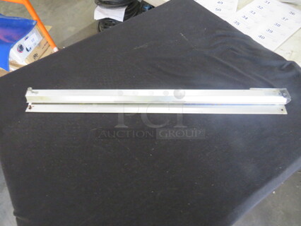 One 24 Inch Stainless Steel Ticket Rail.