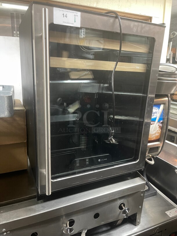 U-line 1175BEVS00 1000 Series
24 inch  Beverage Center with Dual Cooling Zones, 2 Beech-Trimmed Wine Racks, 2 Glass Shelves, Touch Pad Digital Controls and Glass Door 115 Volt NSF Tesed and Not getting Cold! - Image 1 of 8