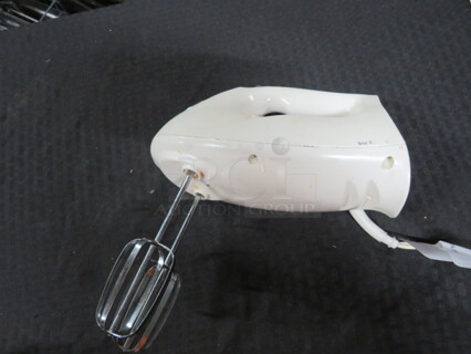 One Hamilton Beach Hand Mixer.
