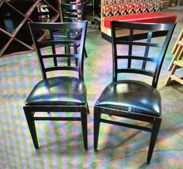 Black Wooden Chair With A Balck Cushioned Seat. 4XBID - Image 1 of 1