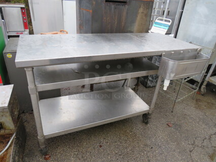 One Stainless Steel Table With 2 Stainless Under Shelves, And Front Dipperwell On Casters. 60X24X36