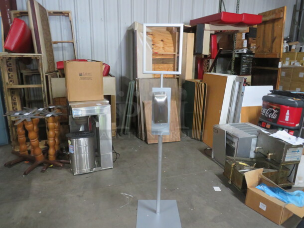 One NEW Sanitizing Station With A Stainless Steel Soap/Sanitize Dispenser, And Frame For Sign. 16X16X68 - Image 1 of 2