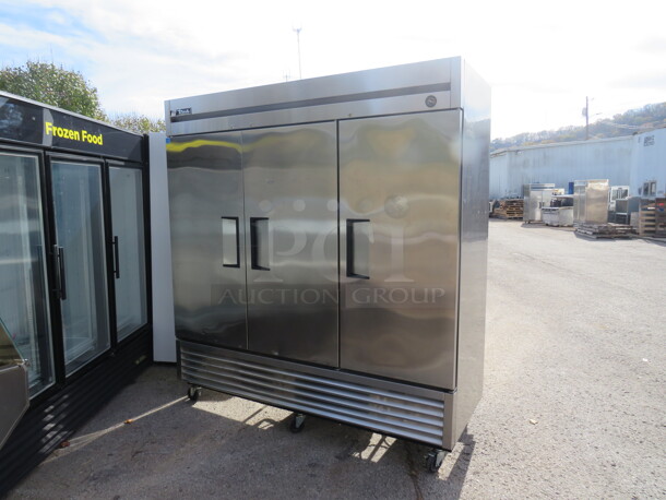 One Stainless Steel 3 Door TRUE Freezer With Racks On Casters. Model# 72F. 115 Volt.  - Image 2 of 6
