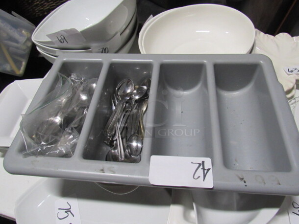 One Flatware Holder With Assorted Flatware.