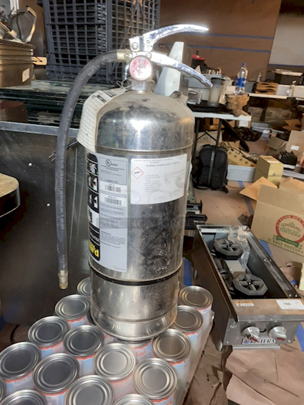 COMMERCIAL KITCHEN SPECIFIC! Ansul® Model K01-3 Sentry® 6 Liter Fire Extinguisher, UL Rating: 2-A:K, 9-1/2”x7”x21-1/4”. Don't Mind The Dust From Remodeling.  - Image 1 of 2