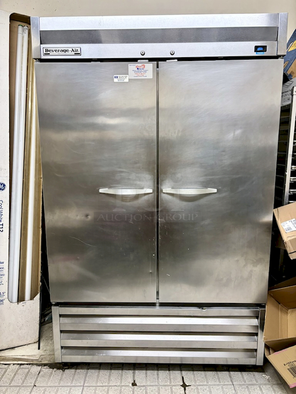 OUTSTANDING!! Beverage Air KF48-1AS 54 inch Reach-In Two-Section Freezer, 49cu.ft., Digital Temperature Control, Bottom Mounted Self-Contained Refrigeration, 3" Casters, 115v/60/1, 10.5 amps. 54x30x78*Food Is Pictured To Demonstrate Freezer Is In Proper Working Order, NOT INCLUDED.  - Image 1 of 4