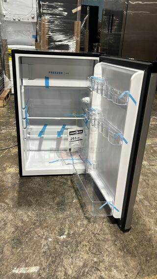 Brand New scratch & dent Frigidaire FFPE4533UM 22 Inch Compact Refrigerator with 4.5 cu. ft. Capacity, 2 Glass Shelves, 3 Door Racks, Built-in Can Dispenser, Reversible Door Swing and ENERGY STAR Qualification: Silver Mist
