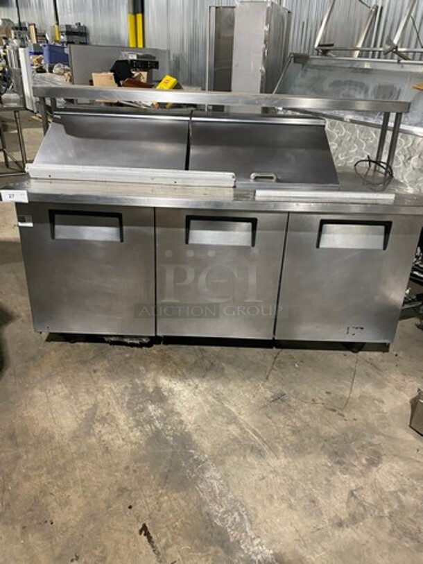 True Commercial Refrigerated Sandwich Prep Table! With Overhead Shelf! With 3 Door Storage Space Underneath! All Stainless Steel! On Casters! Model: TSSU7224MBST SN: 6626819 115V 60HZ 1 Phase