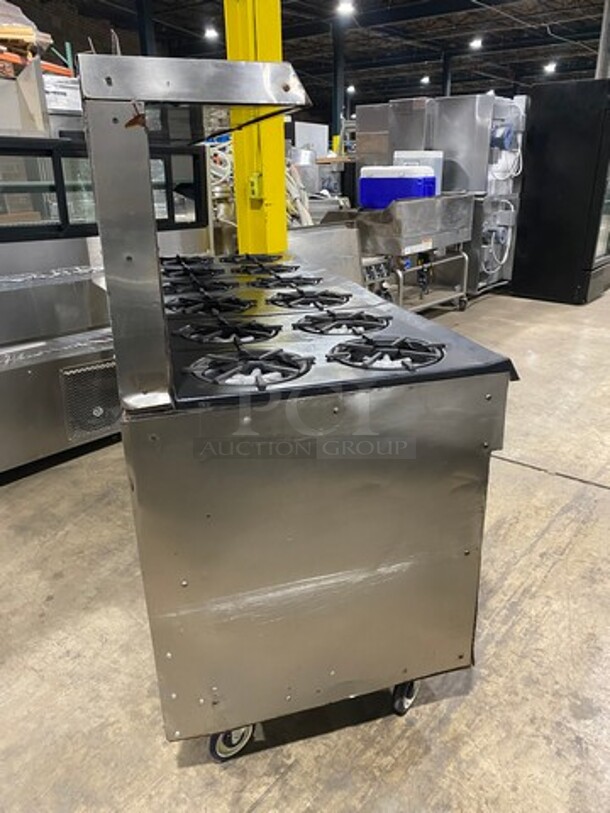AMAZING FIND! Garland Natural Gas Powered 12 Burner Stove! With 2 Full-Sized Ovens! With Metal Oven Racks! With Raised Back Splash & Salamander Shelf! Stainless Steel! On Casters! WORKING WHEN REMOVED! - Image 3 of 11