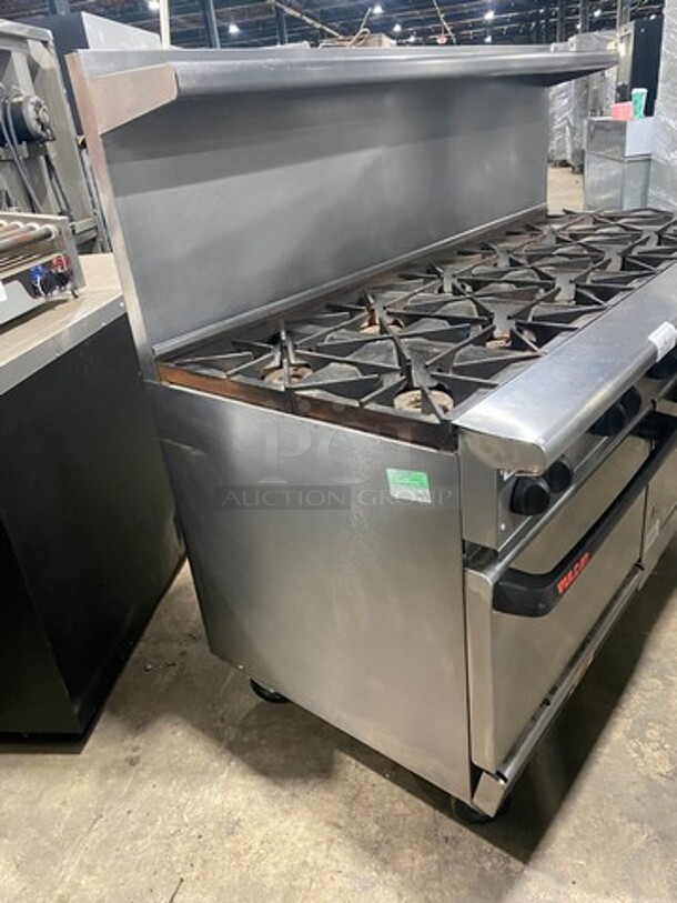 Vulcan Commercial Natural Gas Powered 12 Burner Stove! With Raised Back Splash And Salamander Shelf! With 2 Oven Underneath! All Stainless Steel! On Casters! WORKING WHEN REMOVED! Model: G72SS1AA SN: 659011300 - Image 2 of 11