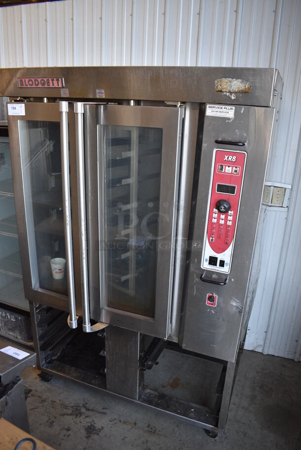 Blodgett Model XR8 Stainless Steel Commercial Natural Gas Powered Mini Rotating Rack Oven w/ Lower Double Pan Rack on Commercial Casters. 47x42x75